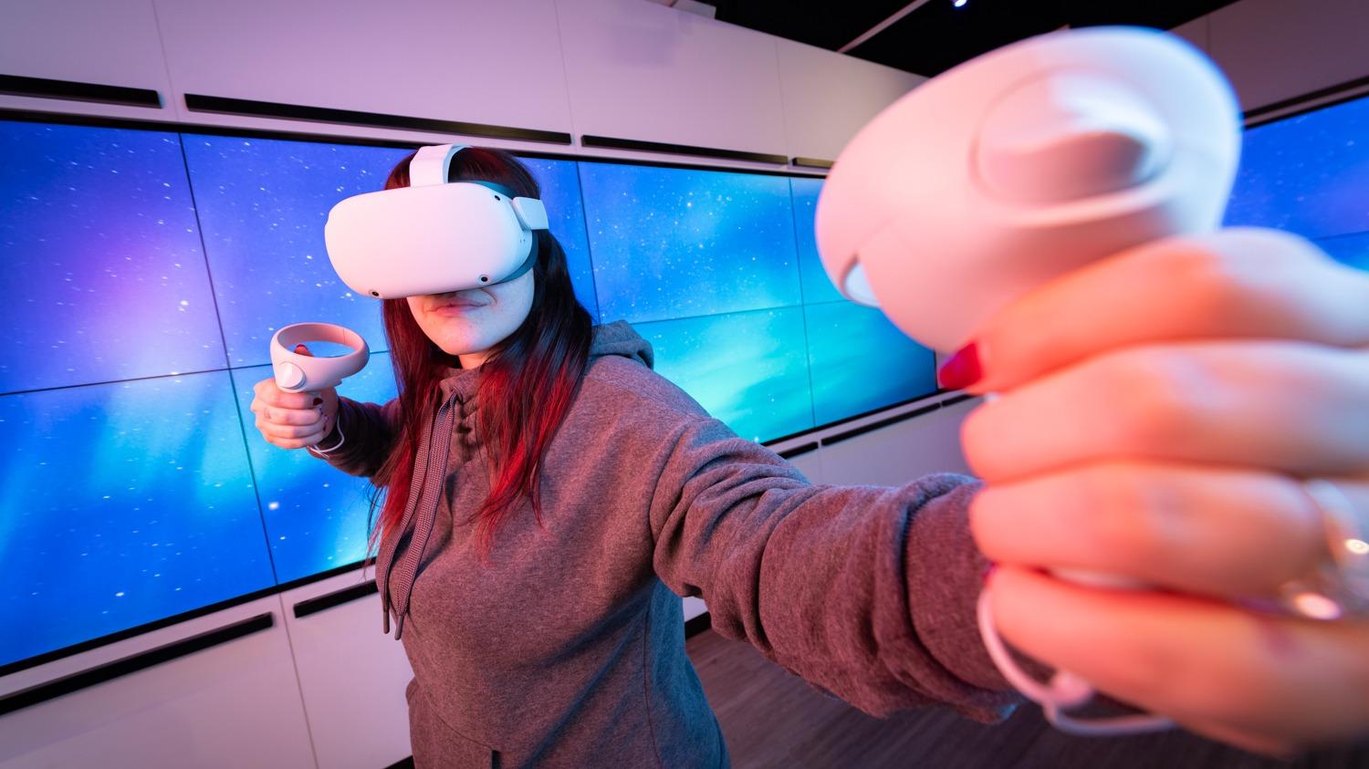 girl using VR headset in sook space Oxford Street
