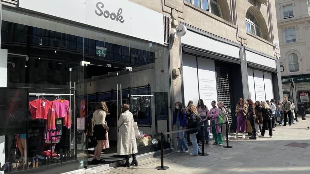 queue of customers waiting to get into pop up at sook oxford street